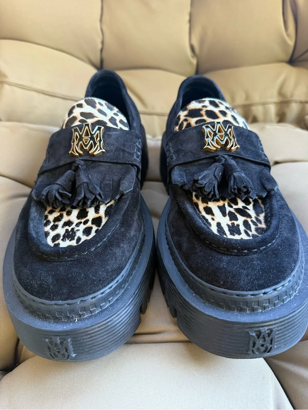 AMIRI Black Suede Tassel Loafers with Leopard Accent and Gold Crest